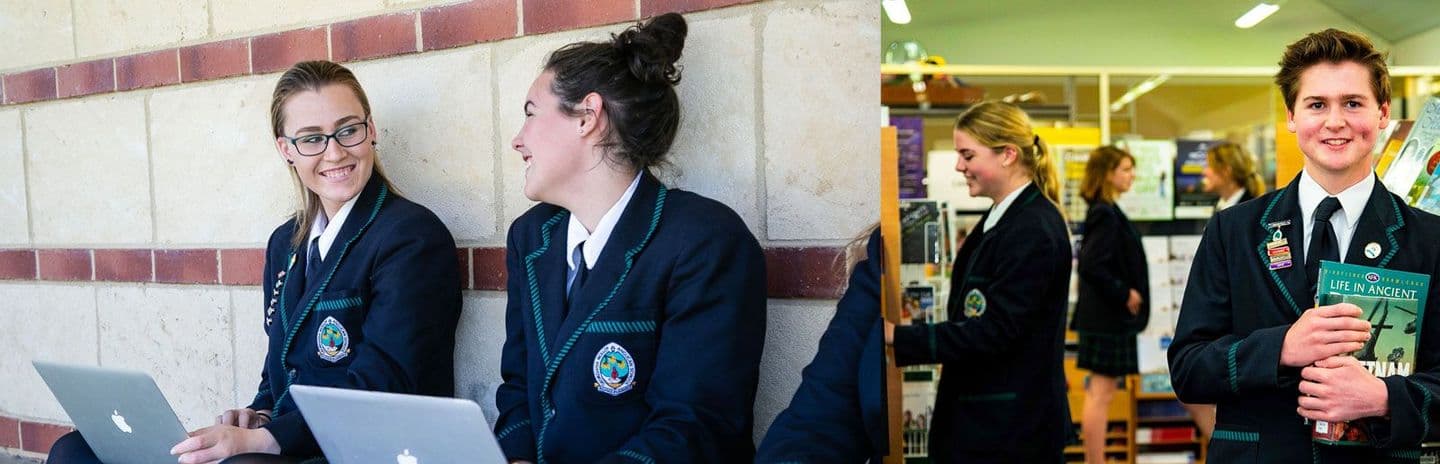 Senior students in school blazer uniforms with laptops